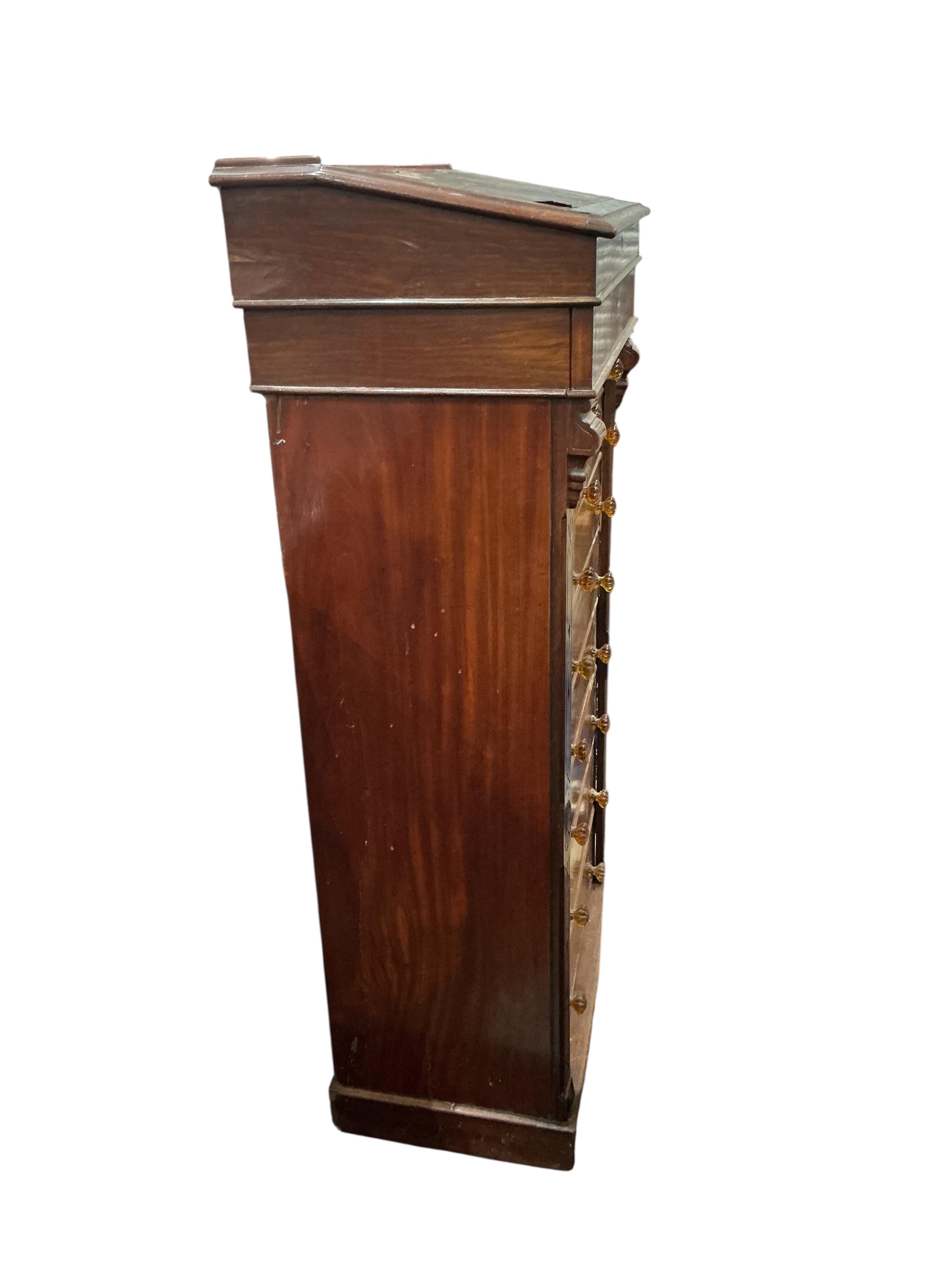 A Victorian mahogany Wellington chest, with writing slope superstructure, width 63cm, depth 40cm, height 130cm